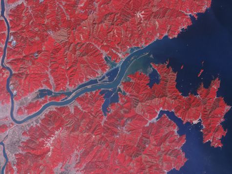 satellite image of tsunami flooding in japan