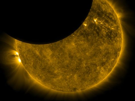 image of the moon passing in front of the sun