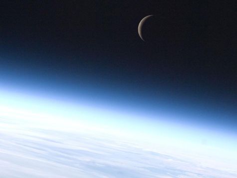 photo of crescent moon from orbit