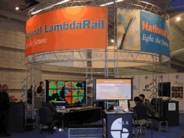 NLR booth at SC2004 with OptIPuter-provided 15-screen tiled display cluster