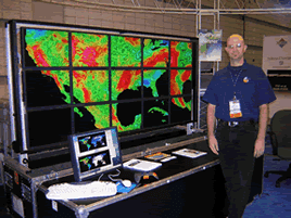 Eric Sokolowsky (GST, Inc.) of GSFC's SVS interactively views model and observation data (set 1) from NASA's Animated Earth project with hyperwall paradigm