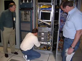 Staff install Force10 Egoo 10-GE switch/router unit