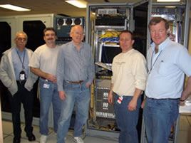 Staff after installation of Force10 Egoo 10-GE switch/router unit