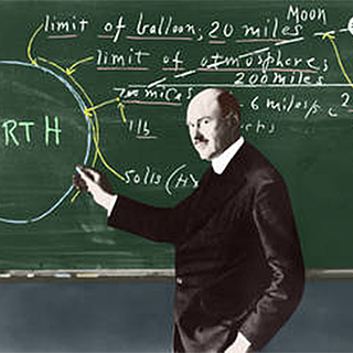 Image of Robert Goddard at chalkboard with mathematical formulas