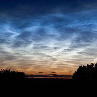 Photo of night-shining (noctilucent) clouds