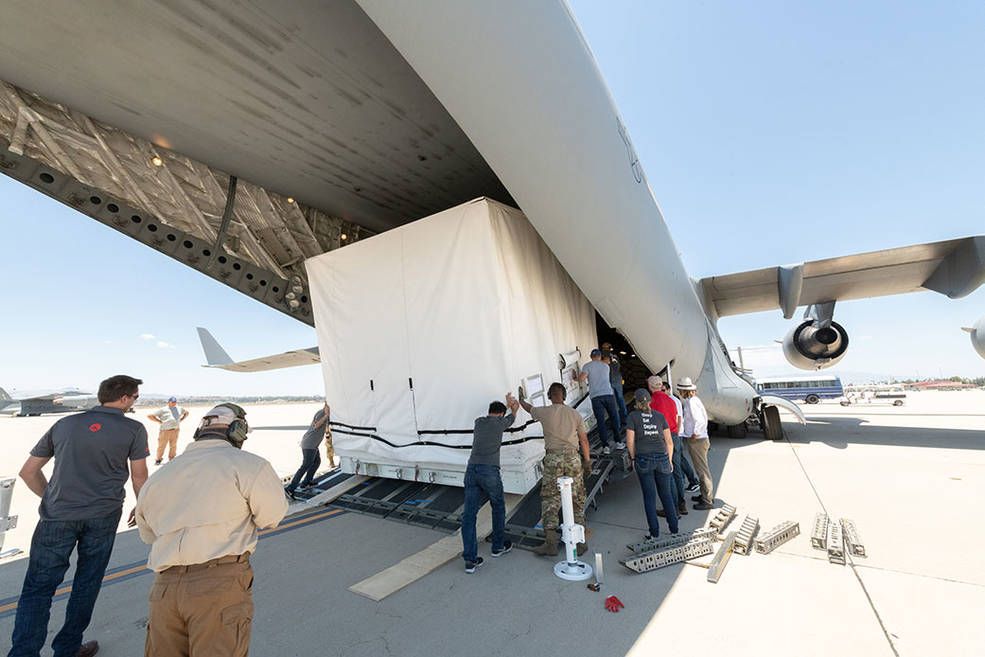 Photo of teams loading SWOT into airplane