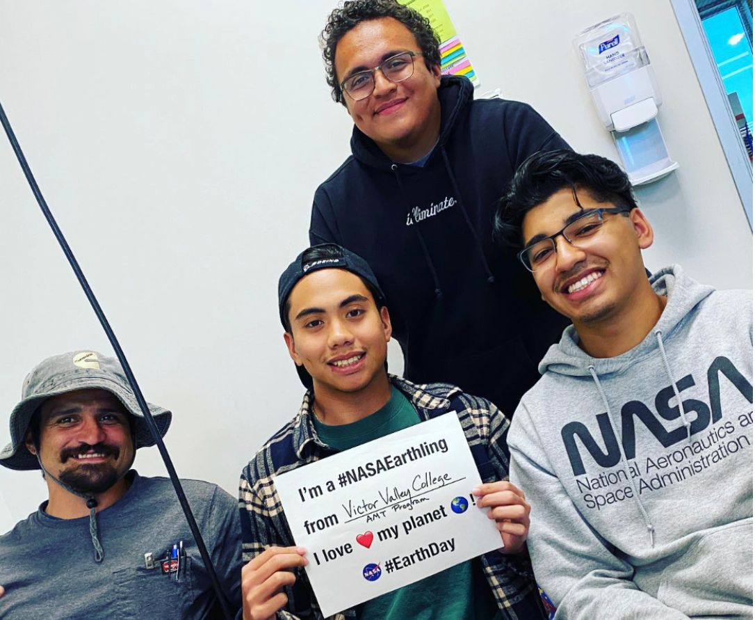 Photo of college students with NASAEarthling sign