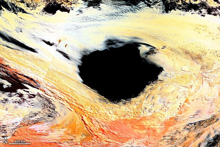 False-color Terra satellite image of hole in the clouds