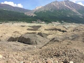 Photo of lower portion of Alaska’s Kennicott Glacier covered by a layer of debris. Image credit: D. Rounce