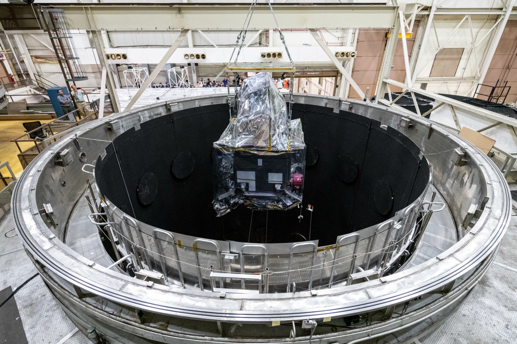 Photo of PACE observatory entering GSFC's thermal vacuum chamber