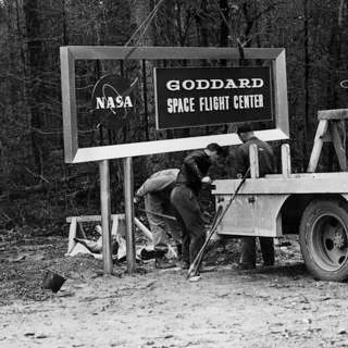 Photo of original sign being installed