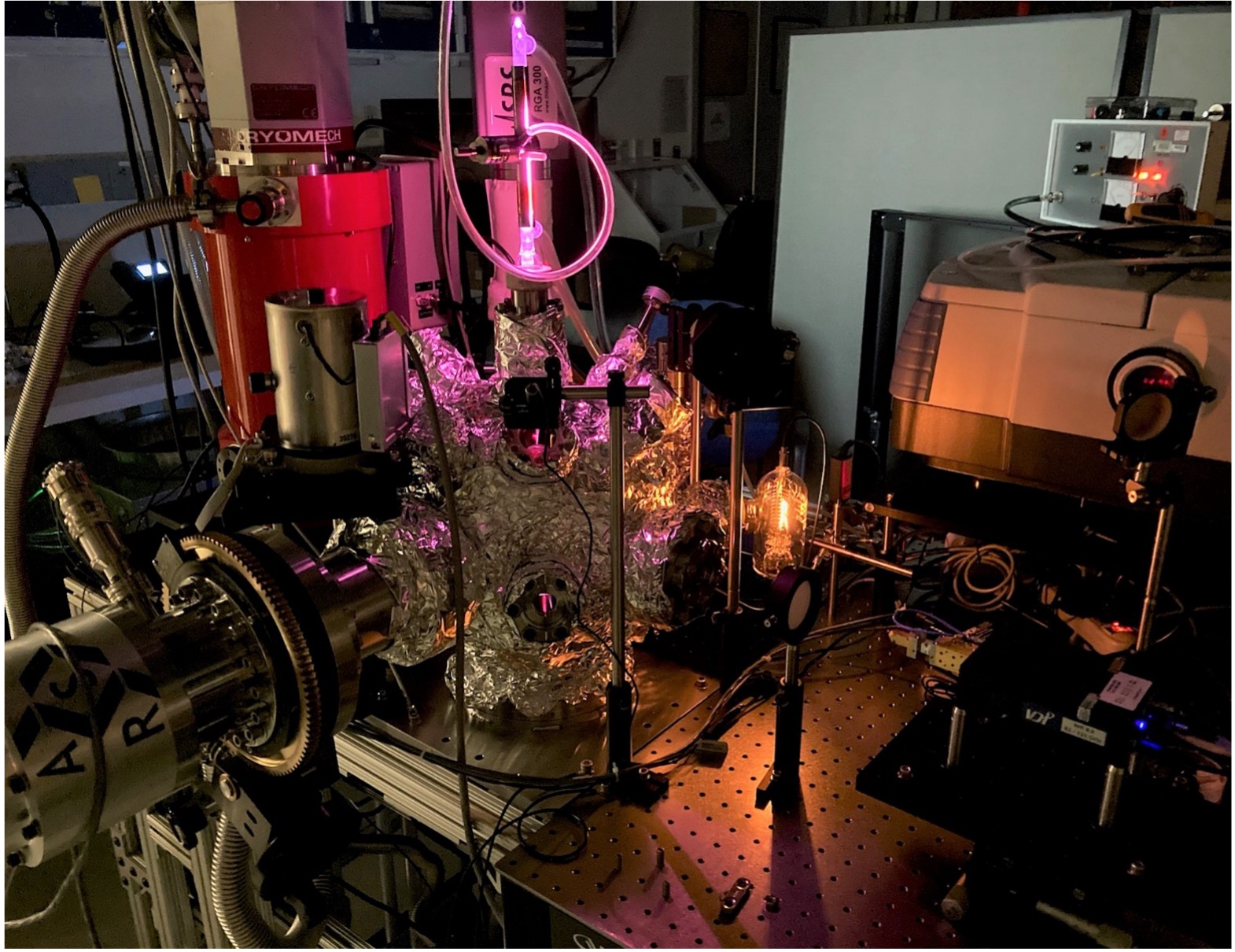 This is what an experiment looks like! An ice deposited inside in the vacuum chamber is exposed to UV light while being monitored with IR spectroscopy and mass spectrometry. The ice is then heated until all molecules are kicked from the surface into the gas phase. We then monitor the composition of the gas with rotational spectroscopy! SubLIME Laboratory, NASA GSFC.