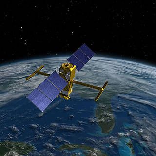 Image of SWOT satellite above Earth