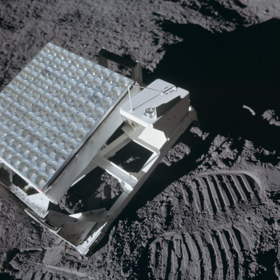 Apollo 14 Lunar Laser Retroreflector Image next to Astronaut footprint in lunar soil.