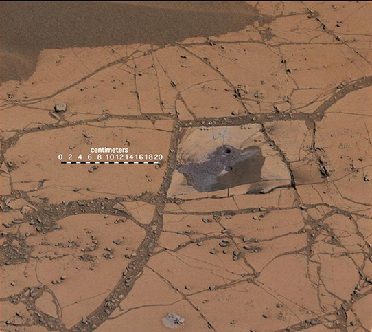 The "Confidence Hills" drill hole within the "Pahrump Hills" outcrop, the first hole drilled into the base of Mount Sharp by NASA’s Curiosity rover. Credit: NASA/JPL-Caltech/MSSS