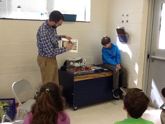 Ryan Danell speaks to elementary school students