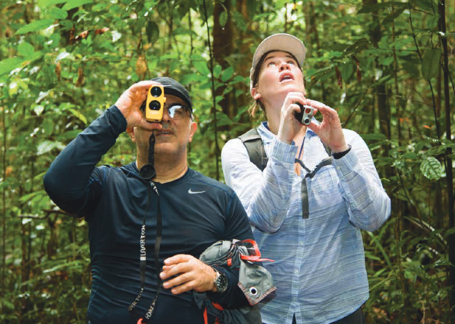 Photo of AfriSAR team members Sassan Saatchi and Laura Duncanson taking measurements of trees in the rainforest in the Mondah National Park, Gabon, Africa