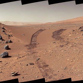 Mars rover image of Mars surface with rover tracks