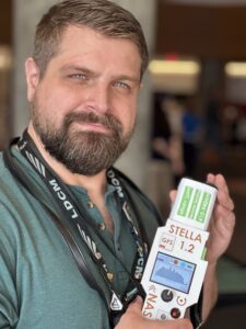 Mike Taylor holding a STELLA-1.2