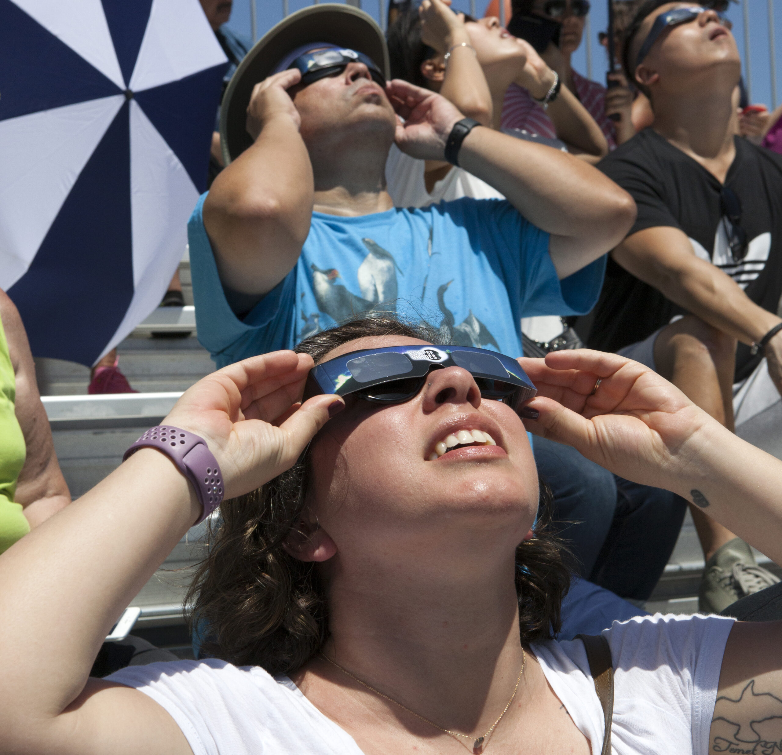 People looking at solar eclipse